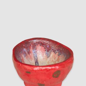 Discover the Kattu Coccinella Ceramic Bowl, featuring a red exterior with a burn effect, blue ripple inside, and a natural burning glaze. Handcrafted in Australia, perfect for trinkets, jewellery, or as a decorative accent. Australian-made ceramic bowl with a red exterior and burn effect, featuring a blue ripple design inside on a white background with a natural burning glaze.