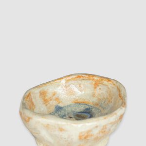 Handmade Australian ceramic bowl with an earthy neutral glaze and subtle blue accents, perfect for everyday use.