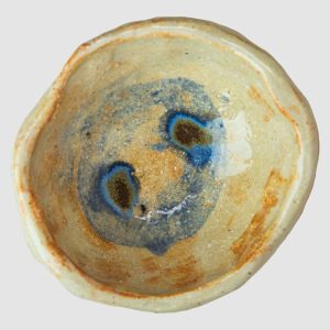 Handmade Australian ceramic bowl with an earthy neutral glaze and subtle blue accents, perfect for everyday use.