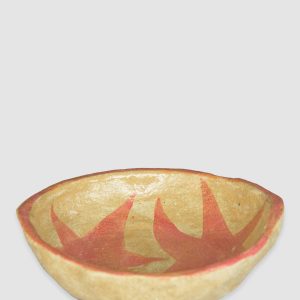 Australian-made ceramic bowl with a natural burnt glaze background and hand-painted red-pink stars connected in an artistic design.